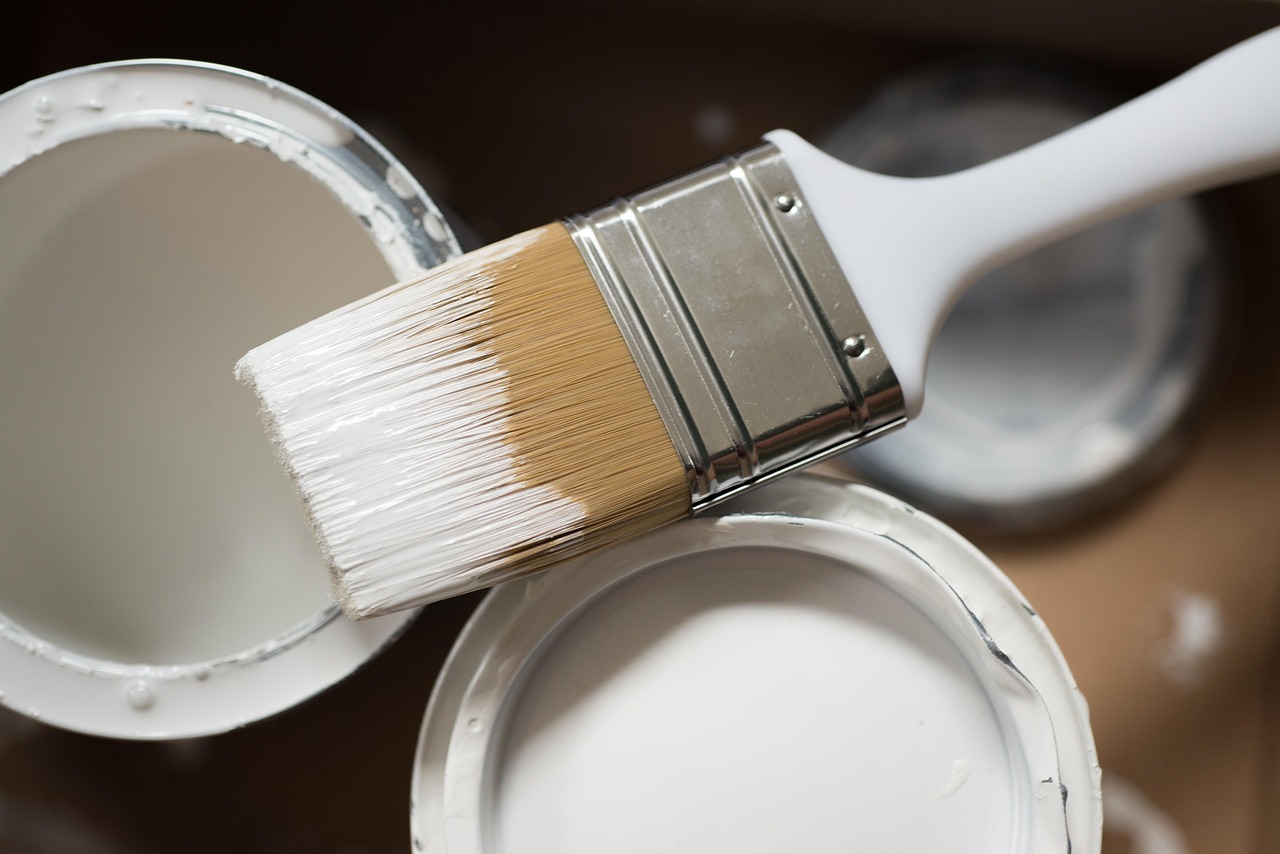 Close-up of a paintbrush and renovation tools used by a skilled handyman